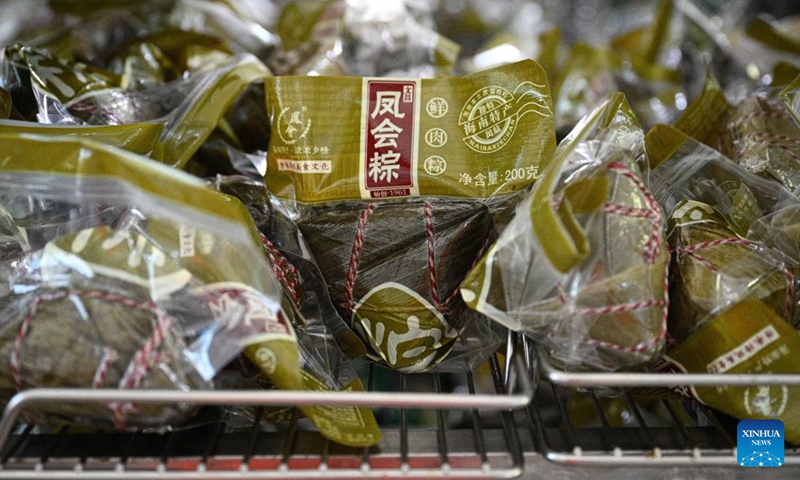 Vacuum packed Fenghui zongzi are seen at a workshop in Wenchang, south China's Hainan Province, June 12, 2026. Fenghui zongzi, which are sticky rice dumplings originated in Fenghui Village of Wenchang, stand as a representative of local zongzi varieties. With the Dragon Boat Festival approaching, local producers of Fenghui zongzi are ramping up production to meet market demand. (Xinhua/Pu Xiaoxu)