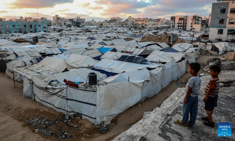 Displaced Palestinian children are seen at a temporary shelter in Gaza City, on June 12, 2026. (Photo by Rizek Abdeljawad/Xinhua)