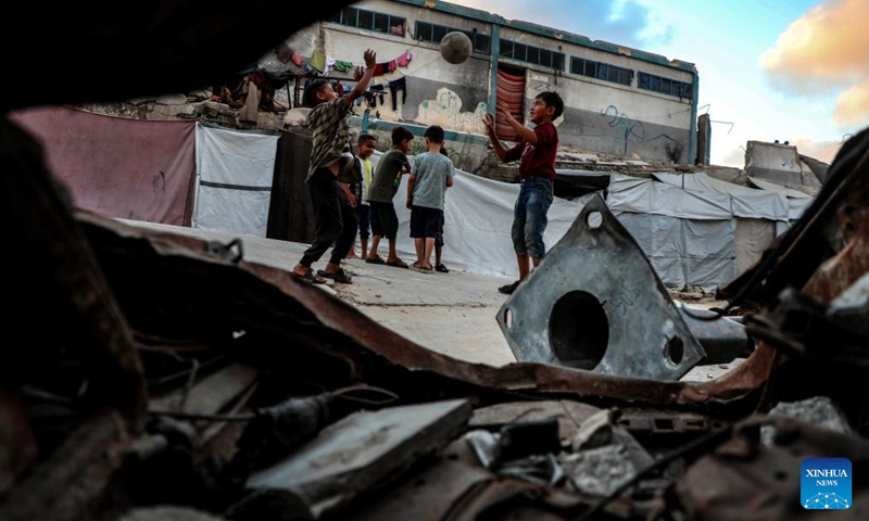 Displaced Palestinian children are seen at a temporary shelter in Gaza City, on June 12, 2026. (Photo by Rizek Abdeljawad/Xinhua)