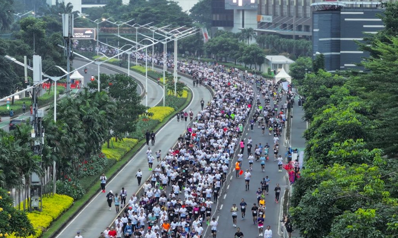 A drone photo shows people participating in the Jakarta International Marathon 2026 in Jakarta, Indonesia, June 14, 2026. (Xinhua/Cen Yunpeng)
