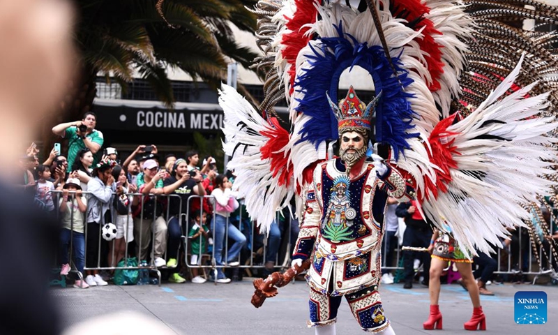 People take part in a World Cup parade in Mexico City, capital of Mexico, June 13, 2026. (Xinhua/Alejandro Medina)