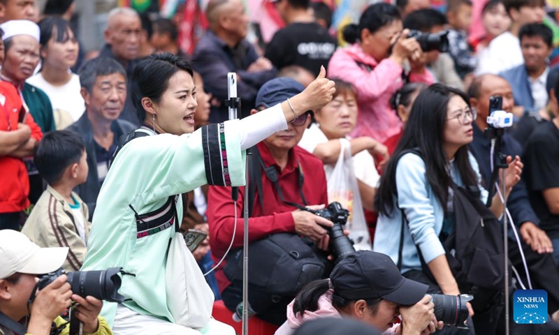 A villager broadcasts Dixi opera performances via live-streaming in Wujiatun of Zhangzhuang Village, Anshun City, southwest China's Guizhou Province, June 13, 2026.(Xinhua/Yang Wenbin)