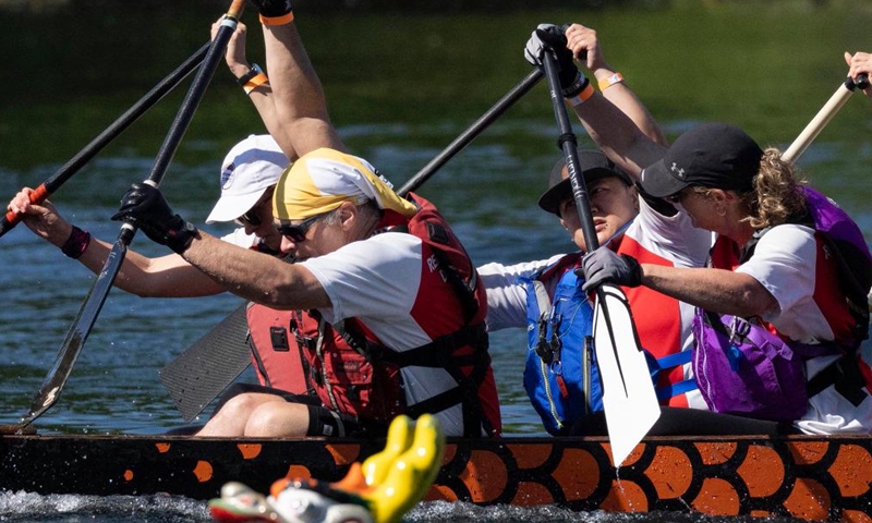 Participants compete on Lake Ontario at the 2026 Toronto International Dragon Boat Race Festival in Toronto, Canada, on June 13, 2026. The annual two-day event kicked off here on Saturday, attracting hundreds of teams worldwide. (Photo by Zou Zheng/Xinhua)