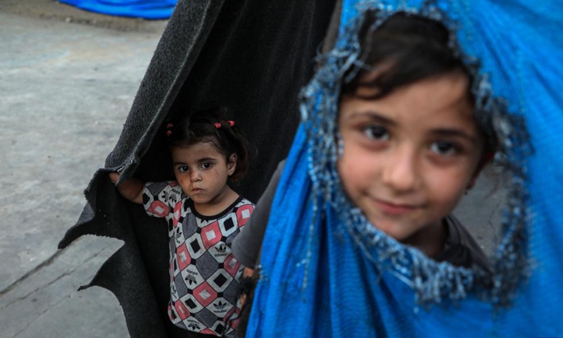 Displaced Palestinian children are seen at a temporary shelter in Gaza City, on June 12, 2026. (Photo by Rizek Abdeljawad/Xinhua)
