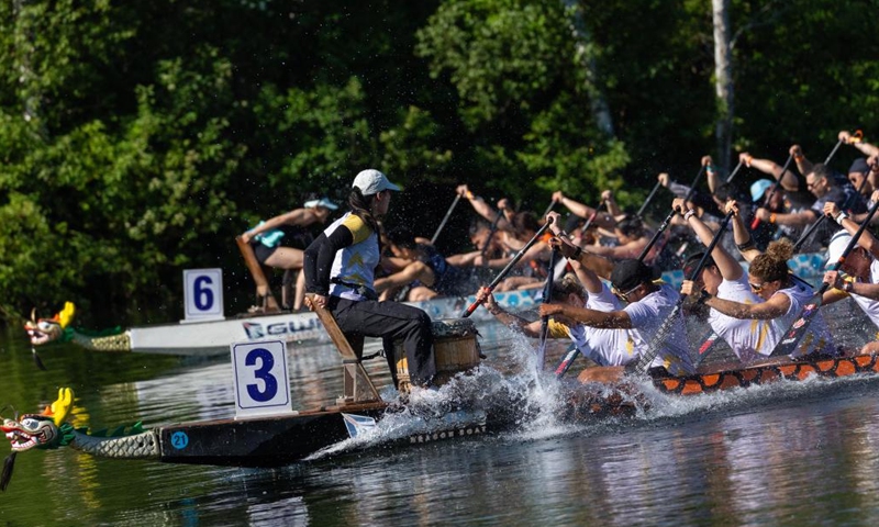 Participants compete on Lake Ontario at the 2026 Toronto International Dragon Boat Race Festival in Toronto, Canada, on June 13, 2026. The annual two-day event kicked off here on Saturday, attracting hundreds of teams worldwide. (Photo by Zou Zheng/Xinhua)