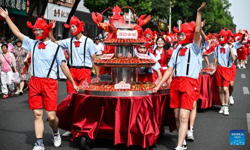 People participate in a crayfish-themed parade in Xuyi, east China's Jiangsu Province, on June 12, 2026. A crayfish-themed parade is held on Friday and Saturday in Xuyi, a well-known crayfish production hub in China. (Xinhua/Ji Chunpeng)