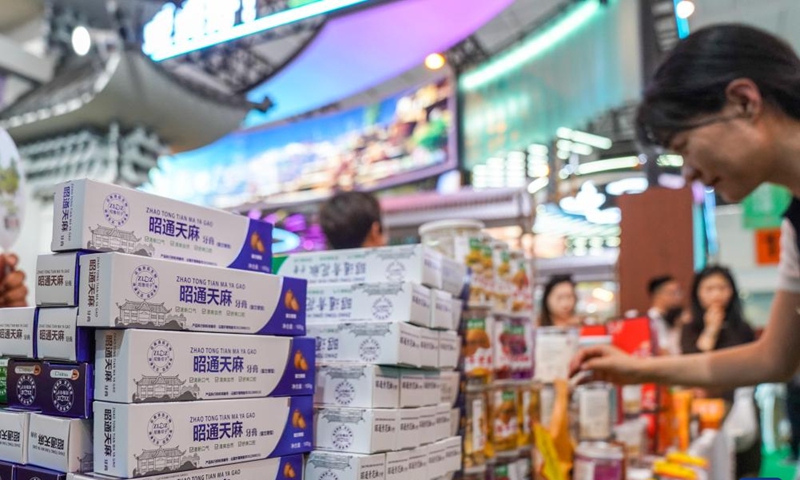 A visitor learns about local products at the 10th China-South Asia Expo in Kunming, southwest China's Yunnan Province, June 13, 2026. The China-South Asia Expo, runs from June 11 to 16 in Kunming of Yunnan Province. A variety of local specialty products displayed at the expo enables visitors to gain a better understanding of Yunnan Province. (Xinhua/Peng Yikai)