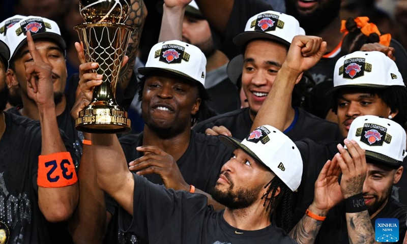 Jalen Brunson (front) of New York Knicks holds the MVP trophy during the awarding ceremony after the final game 5 between New York Knicks and San Antonio Spurs at the 2025-2026 NBA basketball game in San Antonio, the United States, June 13, 2026. (Xinhua/Wu Xiaoling)
