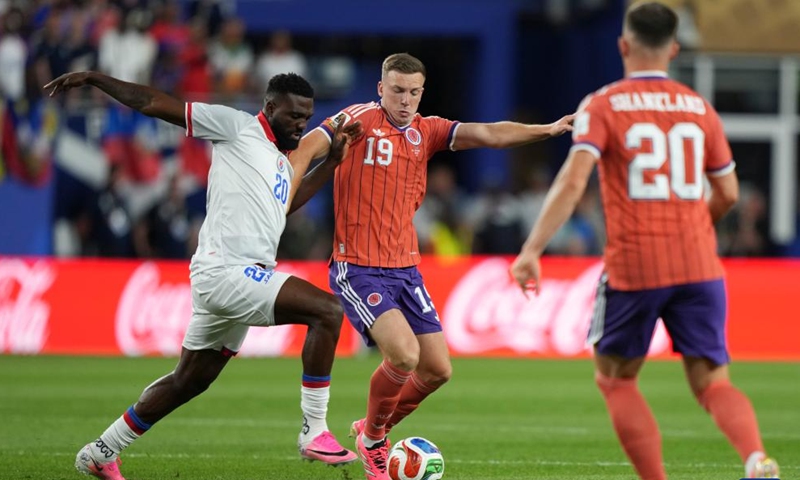 Frantzdy Pierrot (L) of Haiti vies with Lewis Ferguson (C) of Scotland during the group C match between Haiti and Scotland at the 2026 FIFA World Cup at Boston Stadium in Boston, the United States, June 13, 2026. (Xinhua/Chen Yichen)