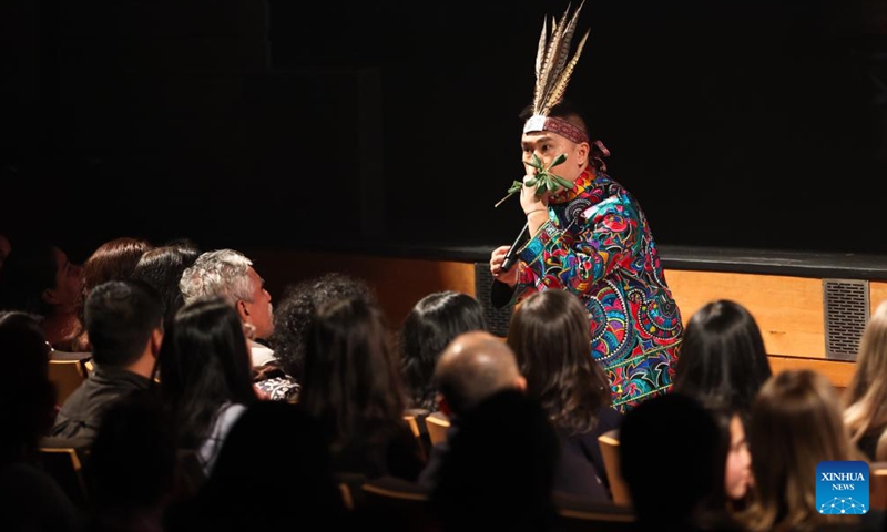 An artist from Guizhou Provincial Song and Dance Theatre performs during a cultural exchange event in Santiago, Chile, June 12, 2026. A cultural exchange event was held in Santiago on Friday to celebrate the International Day for Dialogue among Civilizations and mark the inauguration of the China Cultural Center in Santiago. (Xinhua/Zhou Jiayi)