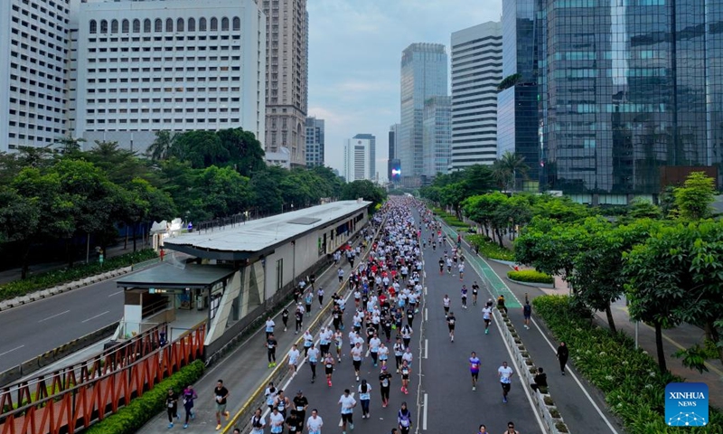 A drone photo shows people participating in the Jakarta International Marathon 2026 in Jakarta, Indonesia, June 14, 2026. (Xinhua/Cen Yunpeng)