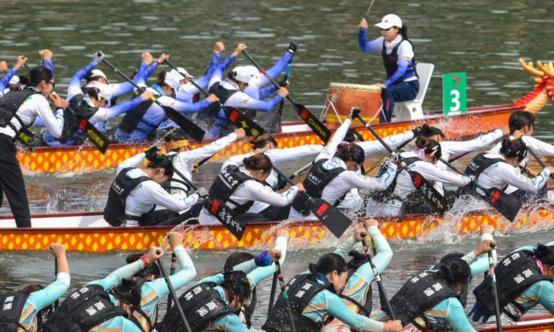 Contestants compete in a dragon boat race in Jingzhou, central China's Hubei Province, on June 13, 2026. Various dragon boat-themed activities have been held across China to welcome the upcoming Dragon Boat Festival, which falls on June 19 this year. (Photo by Ye Liming/Xinhua)