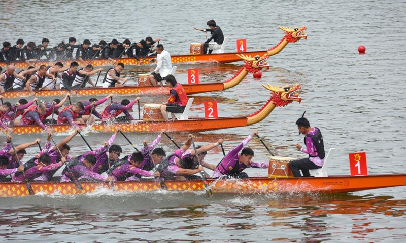 Contestants compete in a dragon boat race in Jingzhou, central China's Hubei Province, on June 13, 2026. Various dragon boat-themed activities have been held across China to welcome the upcoming Dragon Boat Festival, which falls on June 19 this year. (Photo by Ye Liming/Xinhua)