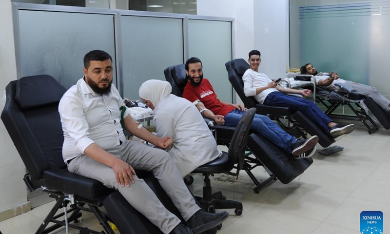 People donate blood to mark the World Blood Donor Day in Damascus, Syria, June 14, 2026. (Photo by Ammar Safarjalani/Xinhua)