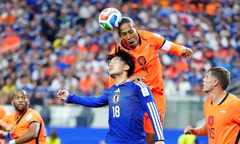Ueda Ayase (2nd L) of Japan vies with Virgil van Dijk (2nd R) of the Netherlands during the group F match between the Netherlands and Japan at the 2026 FIFA World Cup at the Dallas Stadium in Dallas, the United States, on June 14, 2026. (Xinhua/Jia Haocheng)