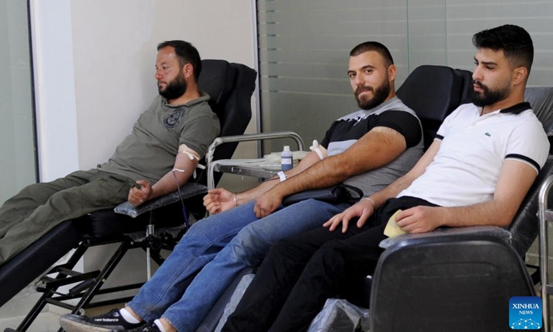 People donate blood to mark the World Blood Donor Day in Damascus, Syria, June 14, 2026. (Photo by Ammar Safarjalani/Xinhua)