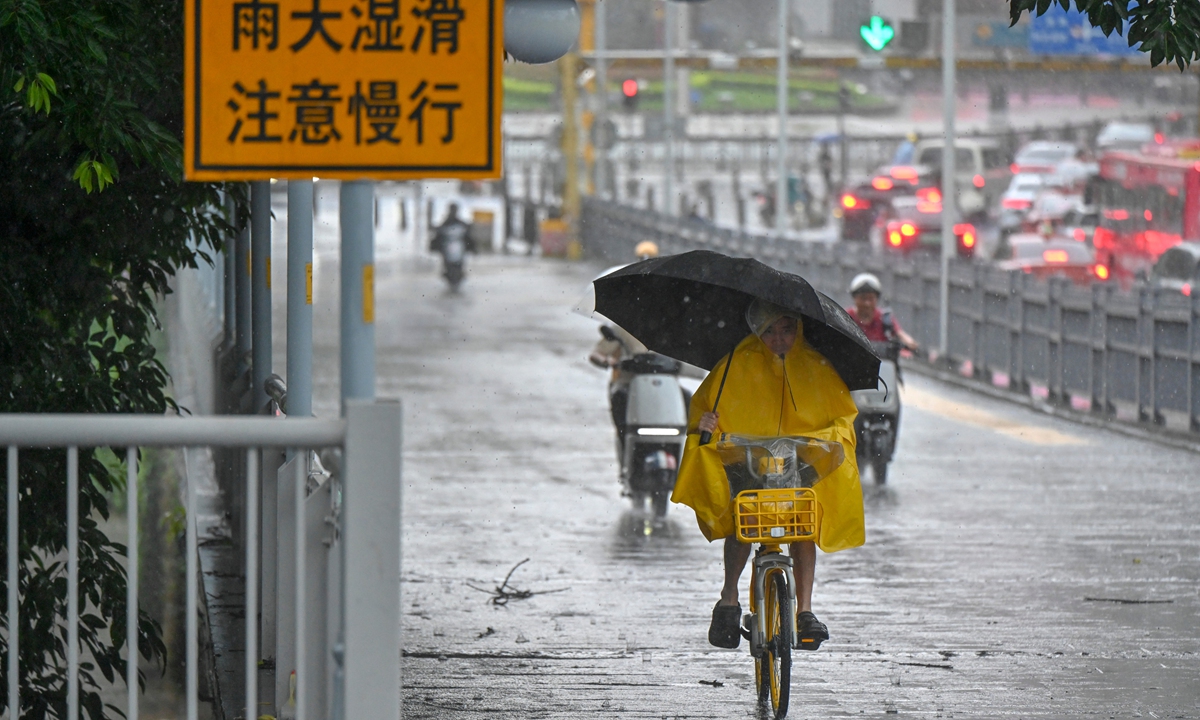 People cycle in the rain in Guangzhou, South China's Guangdong Province, on June 15, 2026. Photo: VCG