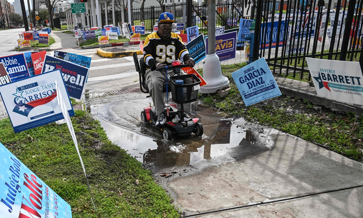 Campaign signs are seen near a polling location at West Gray Metropolitan Multi-Service Center on Election Day in Houston, Texas, on March 3, 2026. Photo: VCG