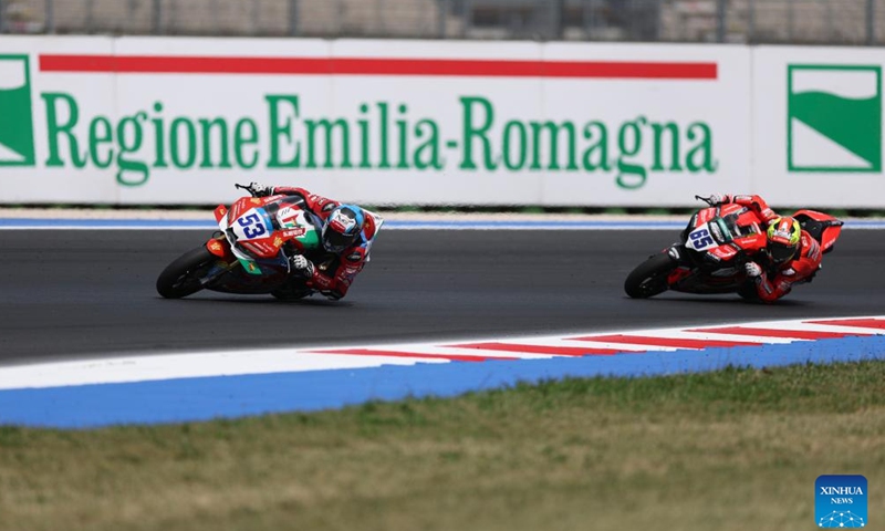 Valentin Debise (L) of EASTROC ZXMOTO Evan Bros Factory competes during the race 2 of WorldSSP at the FIM Supersport World Championship Emilia Romagna Round in Misano Adriatico, Italy, June 14, 2026. (Xinhua/Li Jing)
