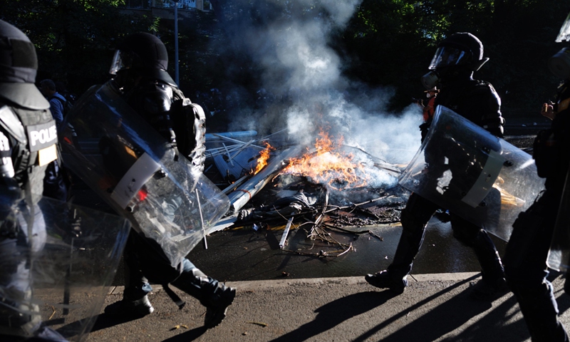 No-G7 activists clash with riot police during a demonstration against the G7 summit in Geneva, Switzerland on June 14, 2026. Protests opposing the G7 summit, which is scheduled to take place from June 15 to 17 in Evian, France, are centered this weekend in nearby Geneva. Activists have chosen Geneva for its accessibility compared to the high-security perimeter surrounding Evian. Photo: VCG