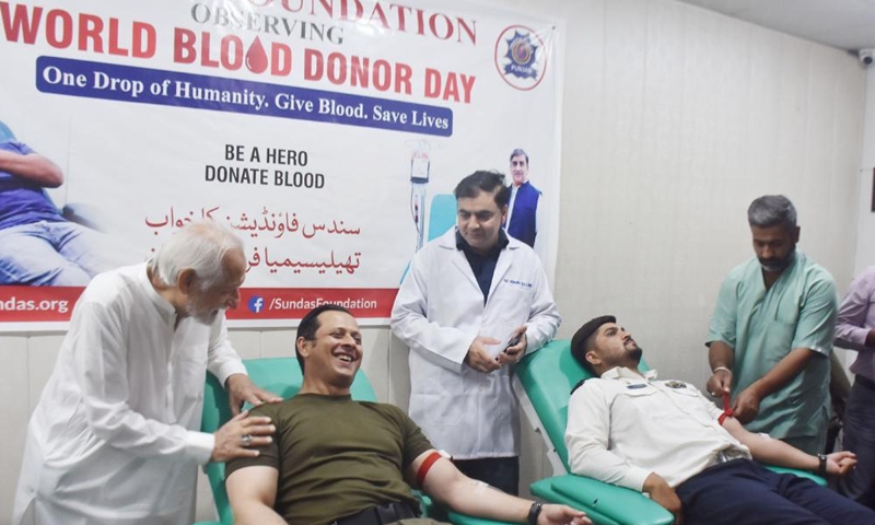 People donate blood to mark the World Blood Donor Day in Lahore, Pakistan, on June 14, 2026. (Photo by Sajjad/Xinhua)