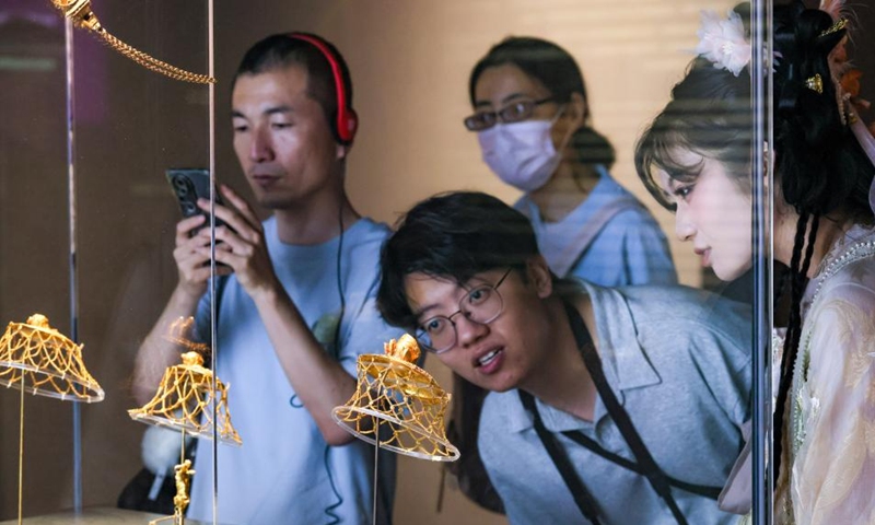 People view exhibits at an exhibition themed Art in Gold: Jewellery in Hellenistic Times in the Shaanxi History Museum in Xi'an, northwest China's Shaanxi Province, June 14, 2026. Gathering 250 pieces or sets of exhibits from 25 Greek museums and archaeological institutions, the exhibition kicked off here on Sunday and will conclude on Nov. 29, 2026. (Photo by Wang Jing/Xinhua)