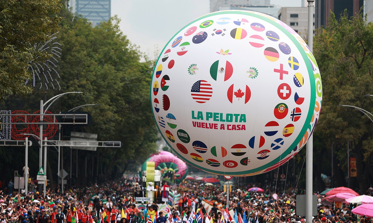 A giant football-themed inflatable figure moves along the route during a World Cup parade in Mexico City, Mexico on June 13, 2026. Thousands of participants, including dancers, floats and giant inflatable figures, took part in the World Cup parade. Photo: VCG