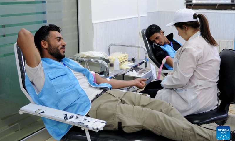 People donate blood to mark the World Blood Donor Day in Damascus, Syria, June 14, 2026. (Photo by Ammar Safarjalani/Xinhua)