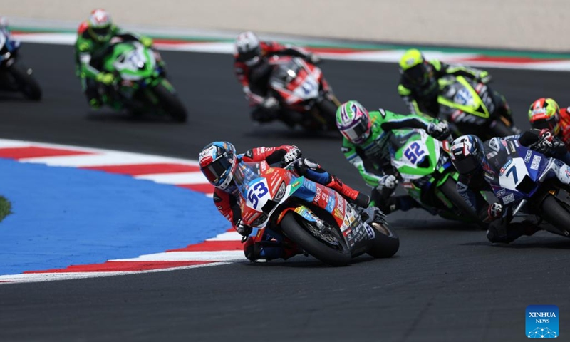 Valentin Debise (front) of EASTROC ZXMOTO Evan Bros Factory competes during the race 2 of WorldSSP at the FIM Supersport World Championship Emilia Romagna Round in Misano Adriatico, Italy, June 14, 2026. (Xinhua/Li Jing)