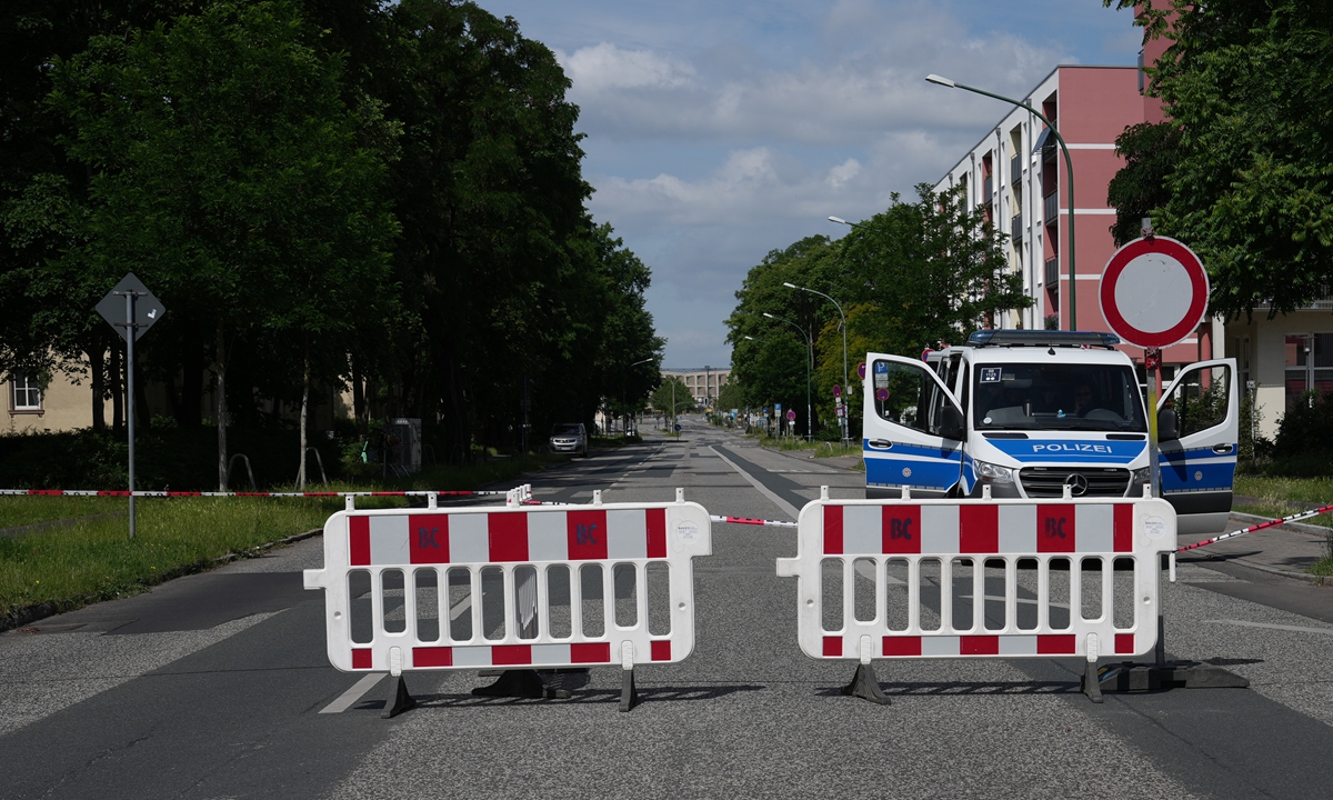 A police vehicle is parked on a closed street not far from the main train station in Potsdam, Germany on June 16, 2026, as parts of downtown Potsdam were evacuated due to the defusing of a 250-kilogram bomb from World War II. Photo: VCG