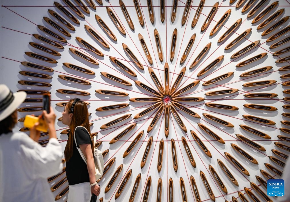 People visit a cultural and art park, transformed from the former cotton textile factories, in Shijiazhuang City, north China's Hebei Province, June 13, 2026. In recent years, Shijiazhuang has advanced the protection and utilization of industrial heritage, injecting new vitality to the city's development. A number of old factory buildings and former industrial sites have been transformed into urban cultural landmarks, leisure and sports parks, creative markets and other new spaces. (Photo: Xinhua)