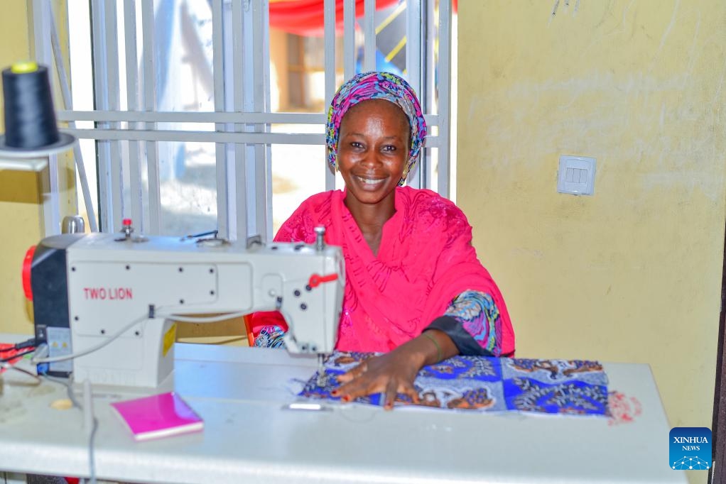 A woman works with a sewing machine at a vocational training center and tricycle workshop in Maiduguri, Nigeria, June 15, 2026. (Photo: Xinhua)