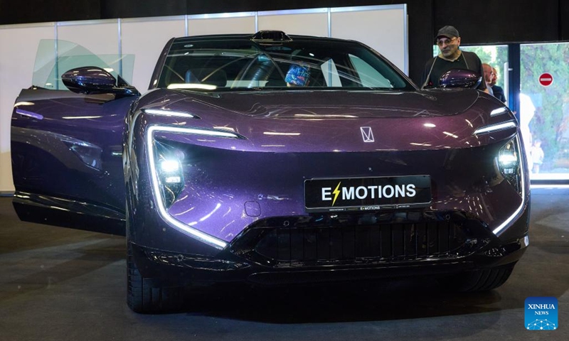 A visitor views an AVATR electric vehicle at Expo Georgia in Tbilisi, Georgia, June 13, 2026. This year's expo was held here from Saturday to Sunday. Chinese automakers including BYD, XPeng, AVATR and JAC Motors have made appearances with their products at the expo. (Photo: Xinhua)