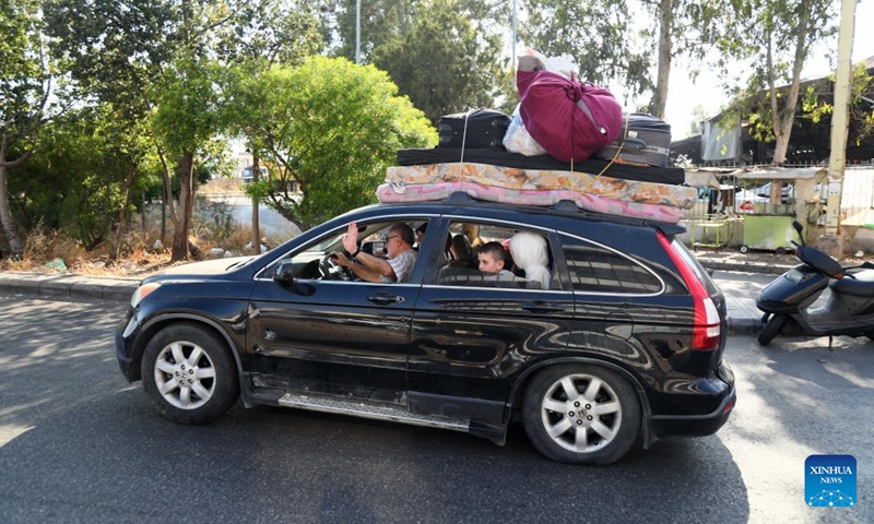This photo taken on June 15, 2026 shows displaced people driving back to southern Lebanon in Beirut, Lebanon. (Photo: Xinhua)