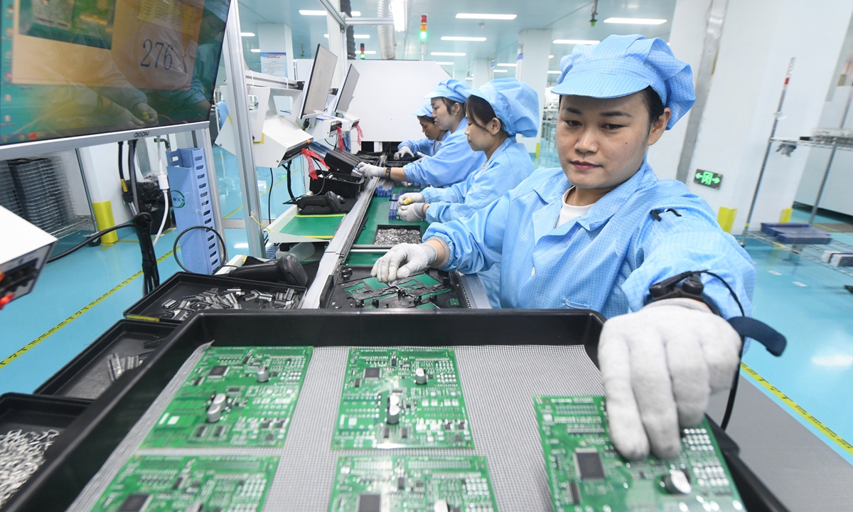 Workers produce electronic components for exports at a factory in Xinle, North China's Hebei Province, on June 16, 2026. In the first five months of 2026, China's total imports and exports of artificial intelligence-related products, including electronic components, computer parts, and optical fibers and cables, surged by 52.4 percent year-on-year, official data showed. Photo: VCG