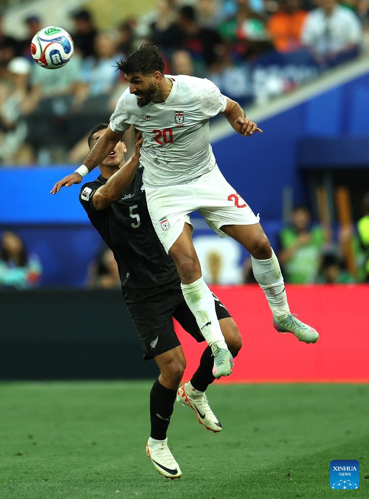 Shahriyar Moghanloo (top) of Iran vies with Michael Boxall of New Zealand during the group G match between Iran and New Zealand at the 2026 FIFA World Cup at Los Angeles Stadium in Los Angeles, the United States, June 15, 2026. (Photo: Xinhua)