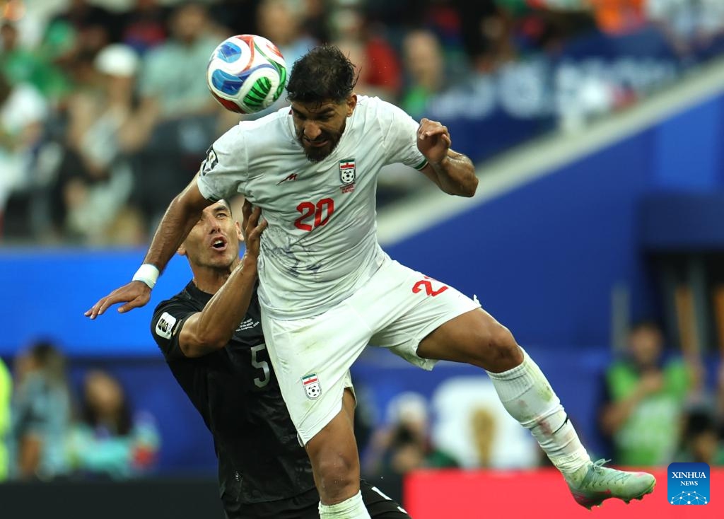 Shahriyar Moghanloo (top) of Iran vies with Michael Boxall of New Zealand during the group G match between Iran and New Zealand at the 2026 FIFA World Cup at Los Angeles Stadium in Los Angeles, the United States, June 15, 2026. (Photo: Xinhua)