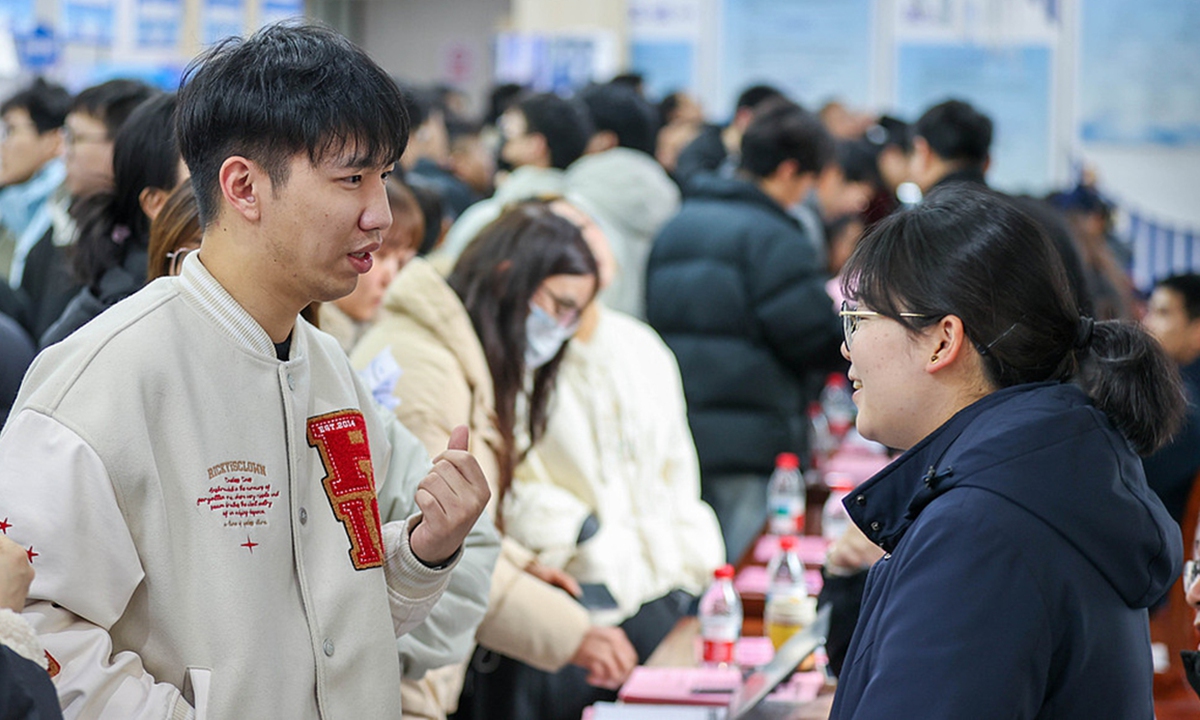 Job seekers review recruitment information at a job fair in Huzhou, East China's Zhejiang Province, on March 2, 2026. Photo: VCG
