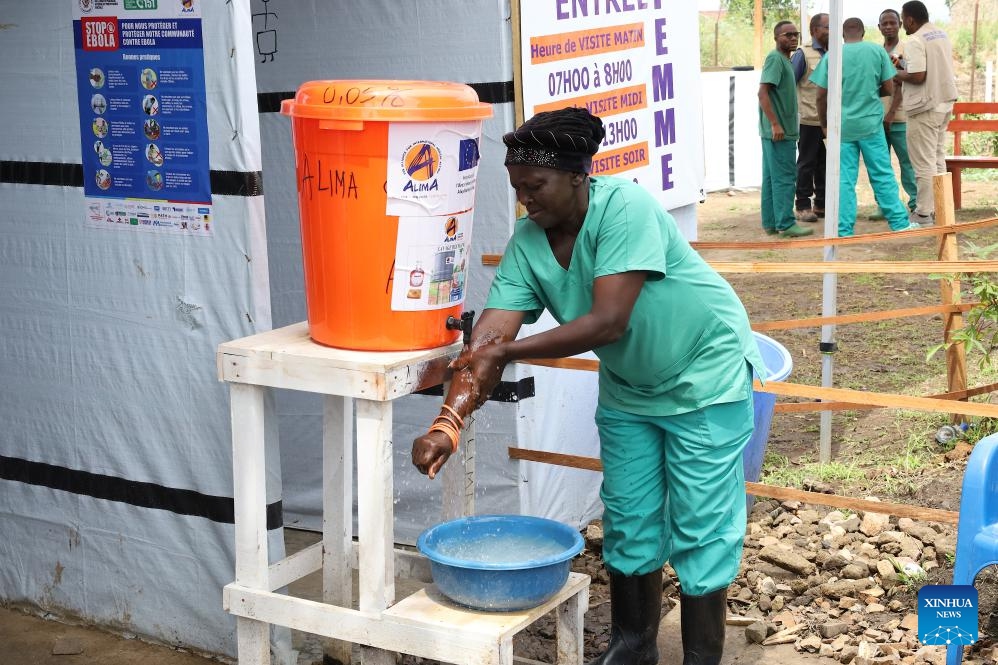 A health worker washes her hands at an Ebola treatment center in Rwampara in eastern Democratic Republic of the Congo, on June 16, 2026. The number of confirmed Ebola cases in the Democratic Republic of the Congo has risen to 837, including 196 deaths, as health authorities and international partners warned that the outbreak continues to deteriorate with sustained community transmission and geographic expansion. (Xinhua)