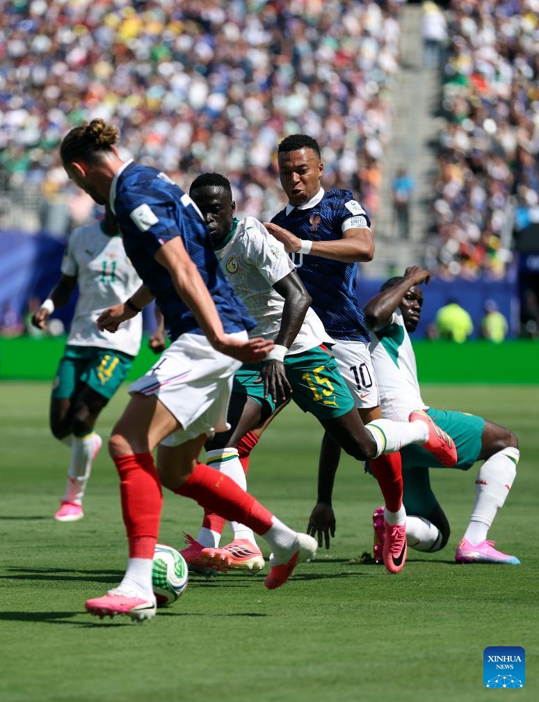 Kylian Mbappe (3rd L) and Adrien Rabiot (1st L) of France compete with Krepin Diatta (2nd L) of Senegal during the group I match between France and Senegal at the 2026 FIFA World Cup at New York New Jersey Stadium in New York, the United States, June 16, 2026. (Xinhua/Cao Can)