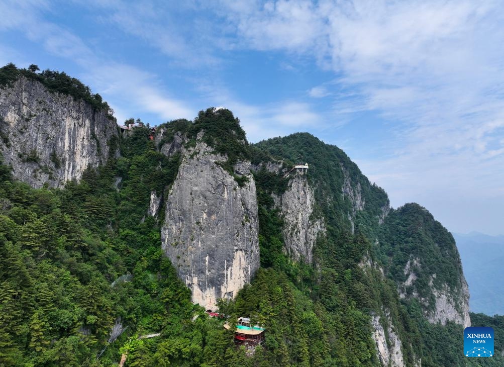 A drone photo taken on June 16, 2026 shows a view of the Qinling Tianzhu Mountain Eco-Cultural Scenic Area in Shangluo, northwest China's Shaanxi Province.
Nestled in the hinterland of the Qinling Mountains, Tianzhu Mountain boasts gorgeous natural scenery and high vegetation coverage, attracting many tourists. (Xinhua/Wang Ying)