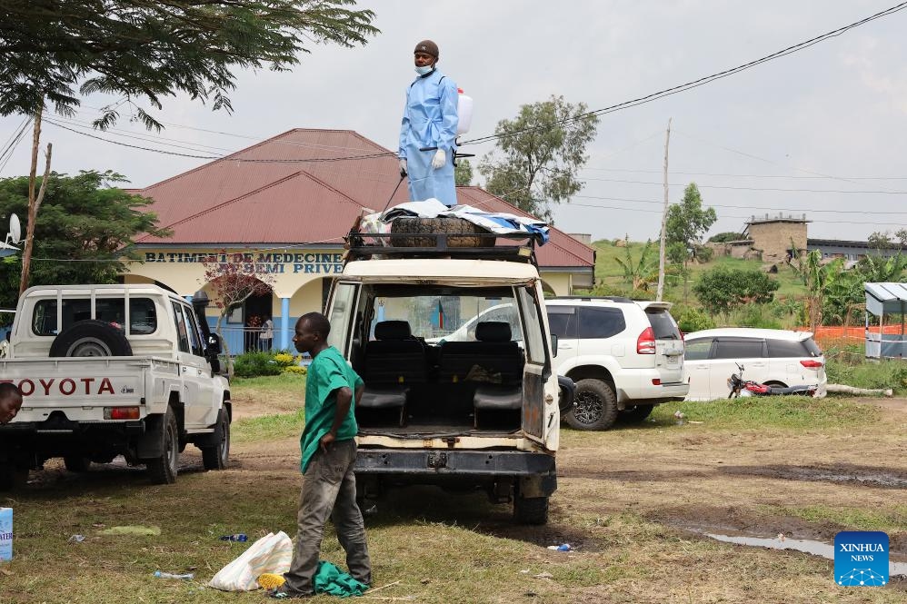 A health worker disinfects a vehicle at an Ebola treatment center in Rwampara in eastern Democratic Republic of the Congo, on June 16, 2026. The number of confirmed Ebola cases in the Democratic Republic of the Congo has risen to 837, including 196 deaths, as health authorities and international partners warned that the outbreak continues to deteriorate with sustained community transmission and geographic expansion. (Xinhua)
