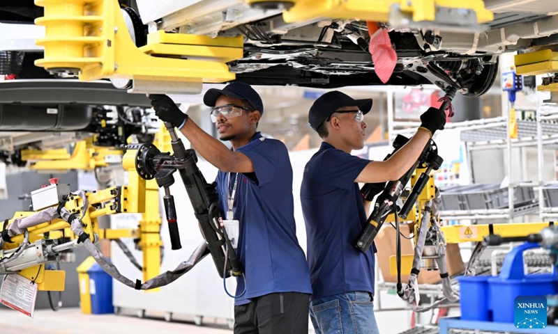 Workers process an automotive chassis at the production base complex of BYD in Camacari, Bahia State, Brazil, June 15, 2026. About 50 kilometers away from Salvador, the capital of the northeastern Brazilian state of Bahia, the Camacari production base complex of Chinese auto manufacturer BYD has been put into operation since last year. (Xinhua/Jin Haoyuan)