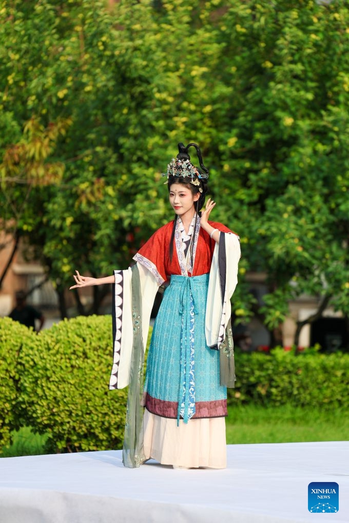 A model presents traditional Chinese costumes during a fashion show at Tianjin Foreign Studies University in north China's Tianjin, June 17, 2026. A show focusing on traditional Chinese costumes was held here on Wednesday as part of this year's Tianjin Fashion Week. Models and foreign students trooped the runway to bridge China and rest parts of the world with wearable creations that inspire cultural exchange and mutual learning. (Xinhua/Sun Fanyue)