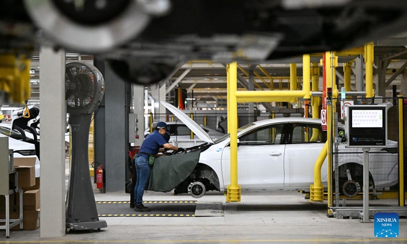 A worker performs assembly work at the production base complex of BYD in Camacari, Bahia State, Brazil, June 12, 2026. About 50 kilometers away from Salvador, the capital of the northeastern Brazilian state of Bahia, the Camacari production base complex of Chinese auto manufacturer BYD has been put into operation since last year. (Xinhua/Jin Haoyuan)
