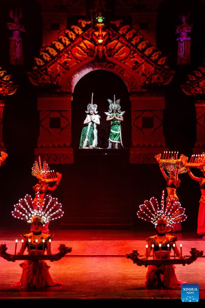 Actors perform during the Mountains Rivers Show in Lijiang, southwest China's Yunnan Province, June 17, 2026. Since its premiere in Lijiang in May 2002, the show has been a long-running hit in 24 years, staging over 21,000 times, and has drawn an audience of about 20 million . (Xinhua/Hu Chao)
