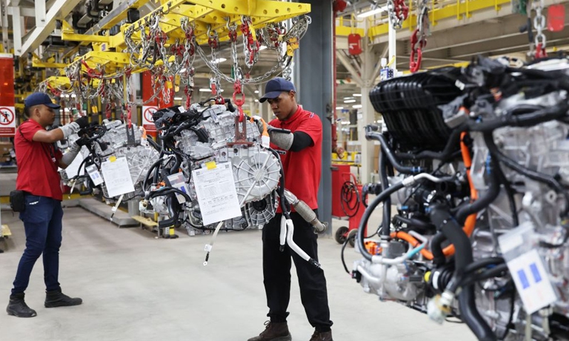 Workers operate on automobile engines at the production base complex of BYD in Camacari, Bahia State, Brazil, June 15, 2026. About 50 kilometers away from Salvador, the capital of the northeastern Brazilian state of Bahia, the Camacari production base complex of Chinese auto manufacturer BYD has been put into operation since last year. (Xinhua/Jin Haoyuan)