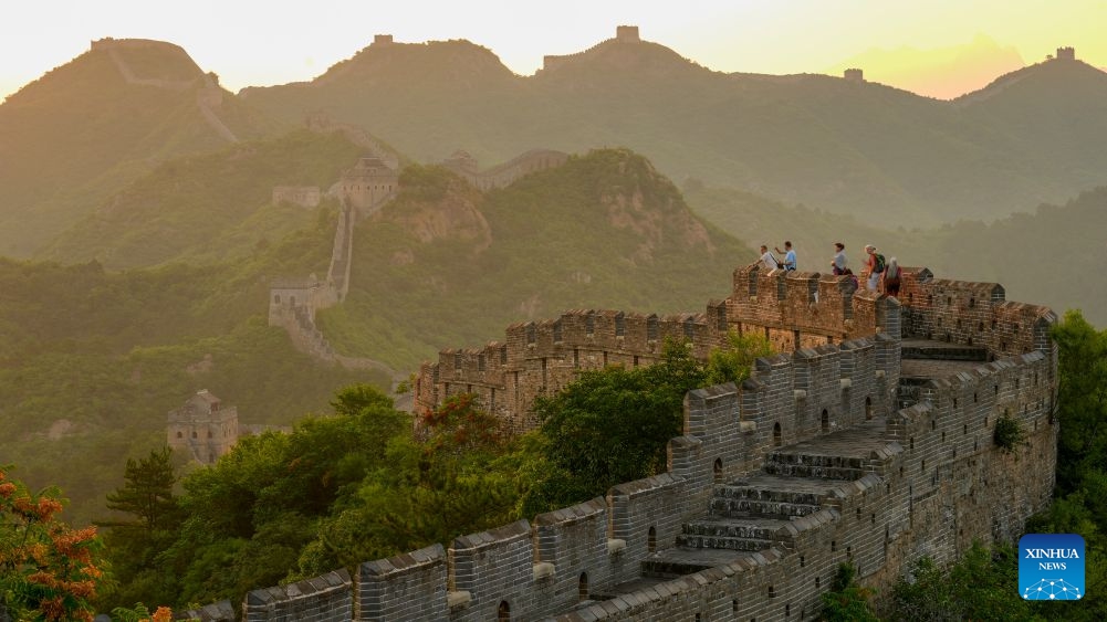 Tourists visit the Jinshanling section of the Great Wall in the morning at Luanping County, north China's Hebei Province, on June 18, 2026. (Photo by Zhou Wanping/Xinhua)