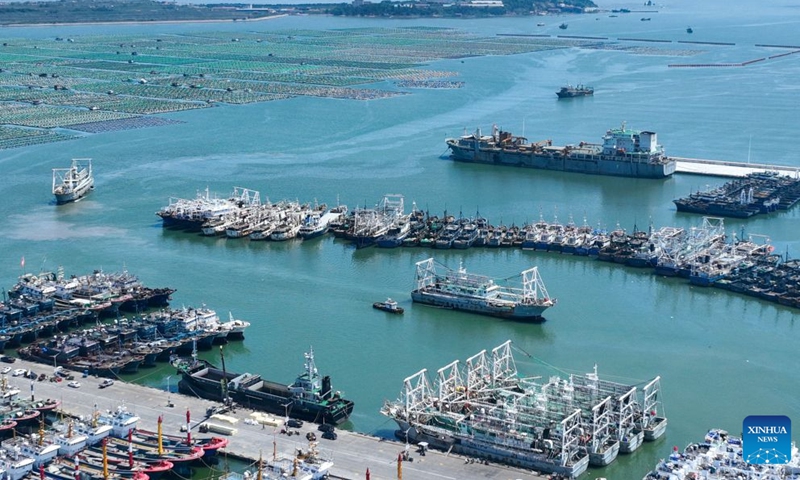 An aerial drone photo taken on June 17, 2026 shows deep-sea fishing vessels docking at a wharf of Shidao Port in Rongcheng, east China's Shandong Province. A fleet of 12 deep-sea fishing vessels returned to Shidao Port with over 2,400 tonnes of catches after a ten-month operation on Wednesday.
The port sees an influx of returning deep-sea fishing vessels around the Dragon Boat festival, which falls on June 19 this year. Expecting more than 80 of these vessels to arrive during the period, local port authorities have implemented measures to facilitate the clearance process for the catches. (Xinhua/Zhu Zheng)
