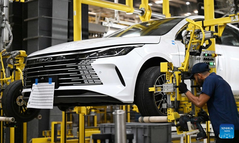 A worker installs a tyre at the production base complex of BYD in Camacari, Bahia State, Brazil, June 12, 2026. About 50 kilometers away from Salvador, the capital of the northeastern Brazilian state of Bahia, the Camacari production base complex of Chinese auto manufacturer BYD has been put into operation since last year. (Xinhua/Jin Haoyuan)